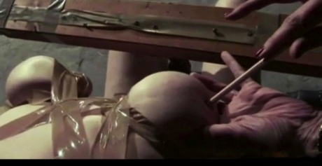 Busty redhead Lori is tortured by a male and female military personnel