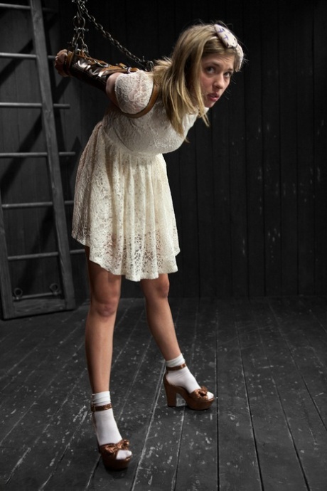 Brunette teen Lia Lor gets tied up and disciplined by a domme in glasses