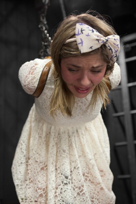 Brunette teen Lia Lor gets tied up and disciplined by a domme in glasses