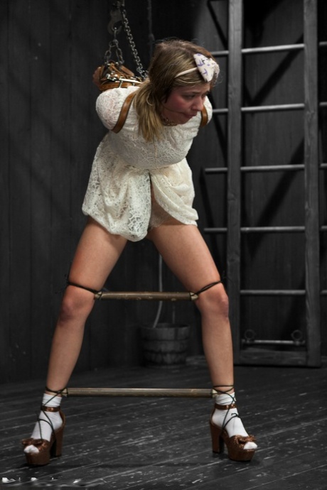 Brunette teen Lia Lor gets tied up and disciplined by a domme in glasses