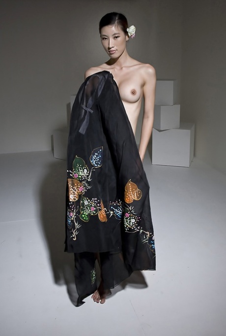 Seductive Korean Eunkyung Oh takes off her outfit and reveals fake titties