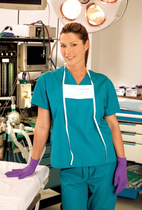 Gorgeous brunette babe Alexia Lee teases with her fake breasts in heels