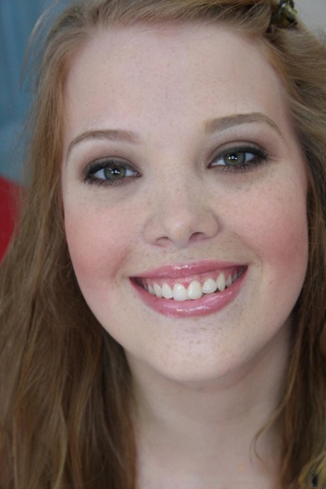 Cute ginger Sierra Skye strips, flaunts her big tits and gives a POV blowjob