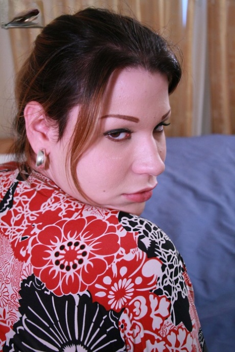 Beautiful shemale Ana masturbates on her bed after a sexy striptease