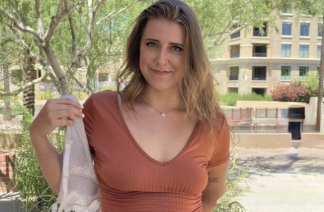 Glamorous brunette babe Sage flashing her panties and bra in public